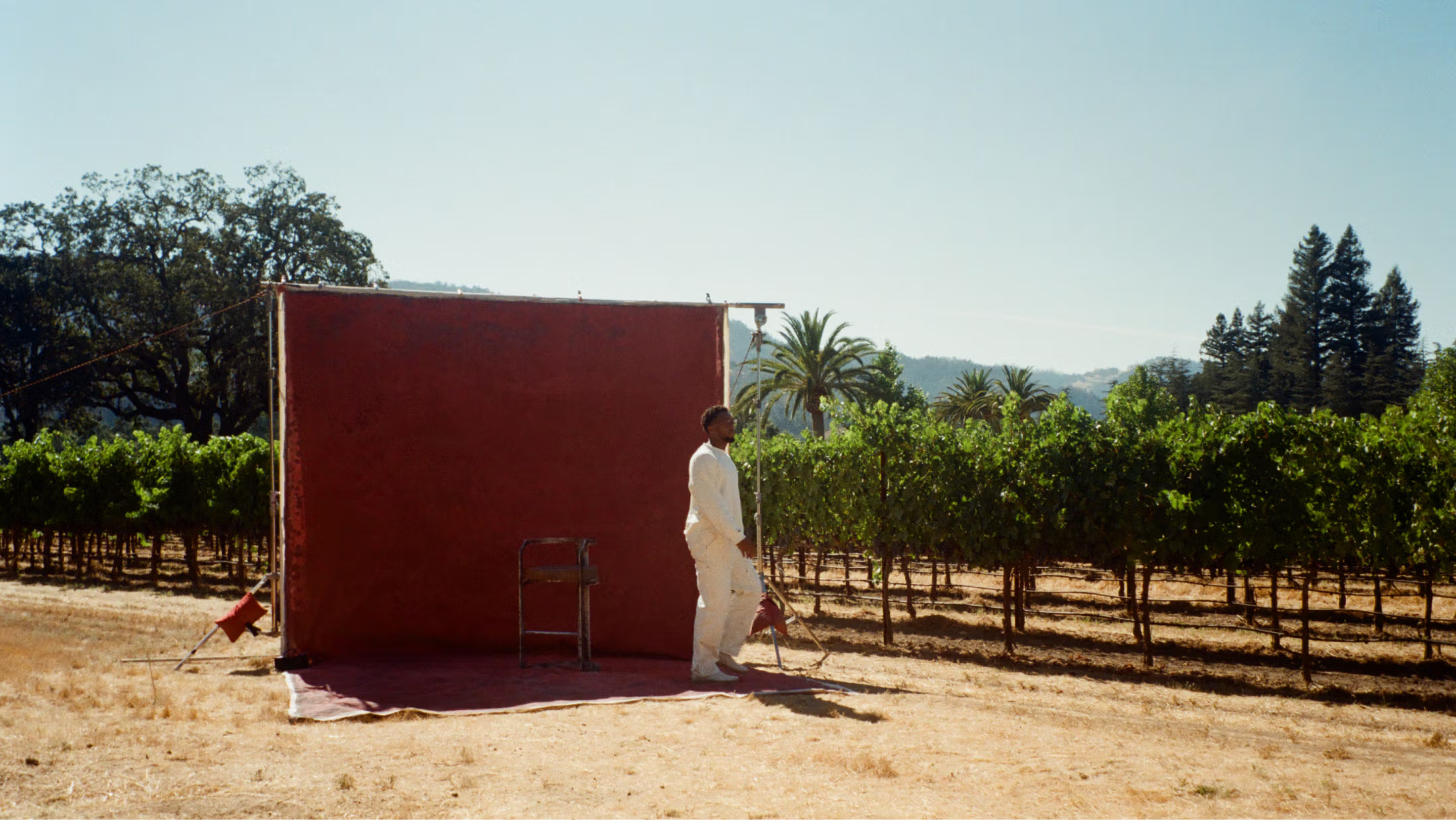 Woman with sunglasses walking down runway
